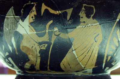 Angel ofering a strigil to a man